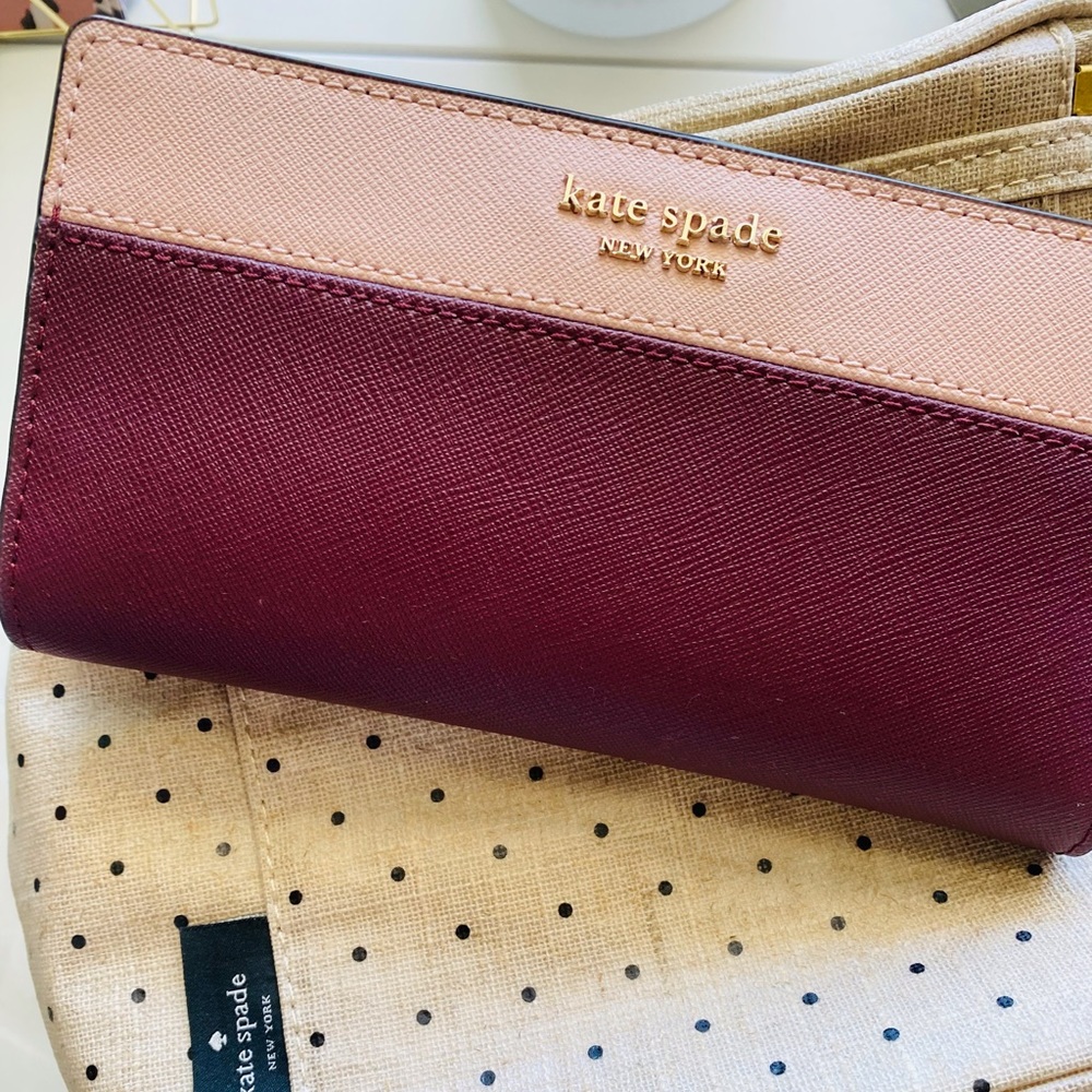 Kate Spade Cameron large bifold wallet in maroon and pink